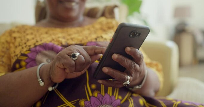 CU SLO MO Senior woman using smart phone at home