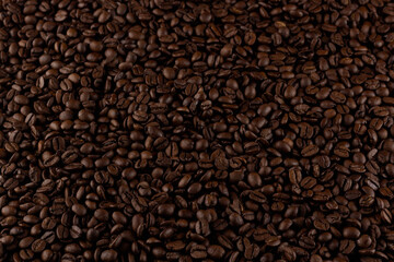 A sea of rich, aromatic coffee beans, the dark texture promising a deep and invigorating flavor experience