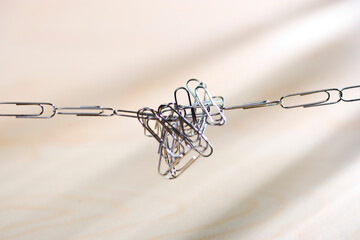 A tangle in a chain of paper clips.