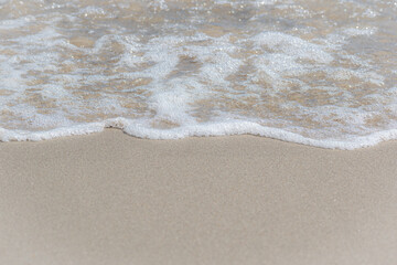Sunny Beach Shoreline where the Ocean Meets the Light Sand