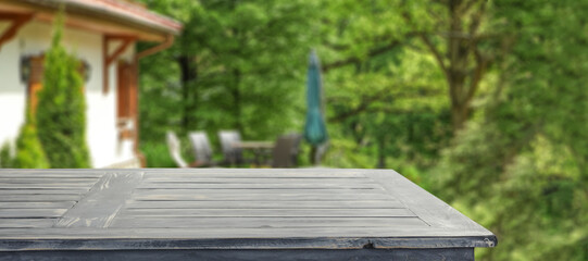 Wooden desk in garden and free space for your decoration. 