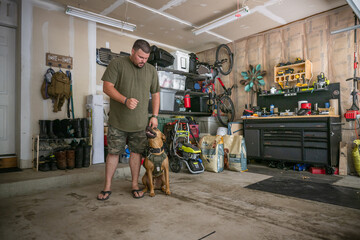 Marine veteran with service dog and family living life.