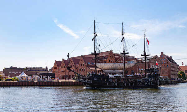Gdansk, Poland - August 13, 2022: A picture of the famous Black Pearl tour ship sailing in Gdansk's Motlawa River.