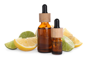 Bottles of citrus essential oil and cut fresh fruits isolated on white