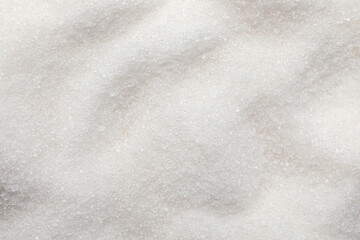 Fototapeta na wymiar Sweet granulated sugar as background, top view