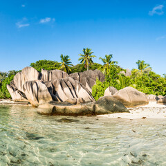 Rock formation with palm trees at Anse Source d'Argent beach, La Digue island, Seychelles