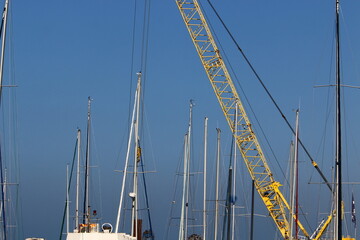 Fototapeta premium Ship masts against the blue sky.