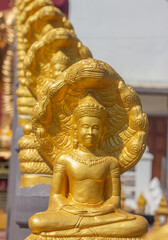 Golden buddha. is respected by those who see it in religion It is an Asian sculpture.