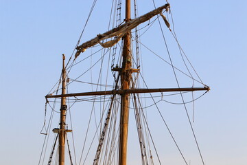 Ship masts against the blue sky.