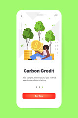 carbon credit concept woman holding golden coins responsibility of co2 emission environmental conservation