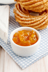 Bowl of peach jam on the breakfast table.