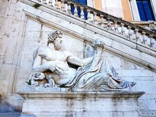 Bas-relief of Neptune on an ancient building in Rome