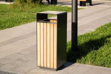 A modern trash can on the street of the city.Accessories on the street of the city.