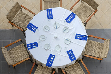 High angle view of setting table and armchairs around it.
