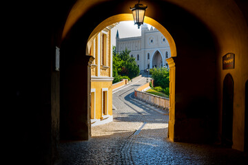 Lublin, Lubelskie Voivodeship / Poland - July 10 2022: Lublin, Lubelskie Voivodeship / Poland - July 10 2022: view from the town gate to the Lublin castle.
