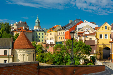 Lublin, Lubelskie Voivodeship / Poland - July 10 2022: tenement houses in Lublin old town illuminated by the morning sun. © slawomir366