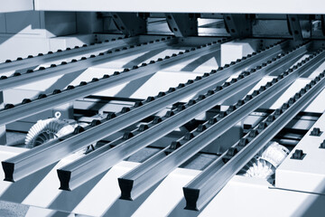 roller conveyor for furniture manufacture for forming furniture parts& Furniture manufacturing. Close-up, industrial concept