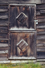 Old wooden door with padlock