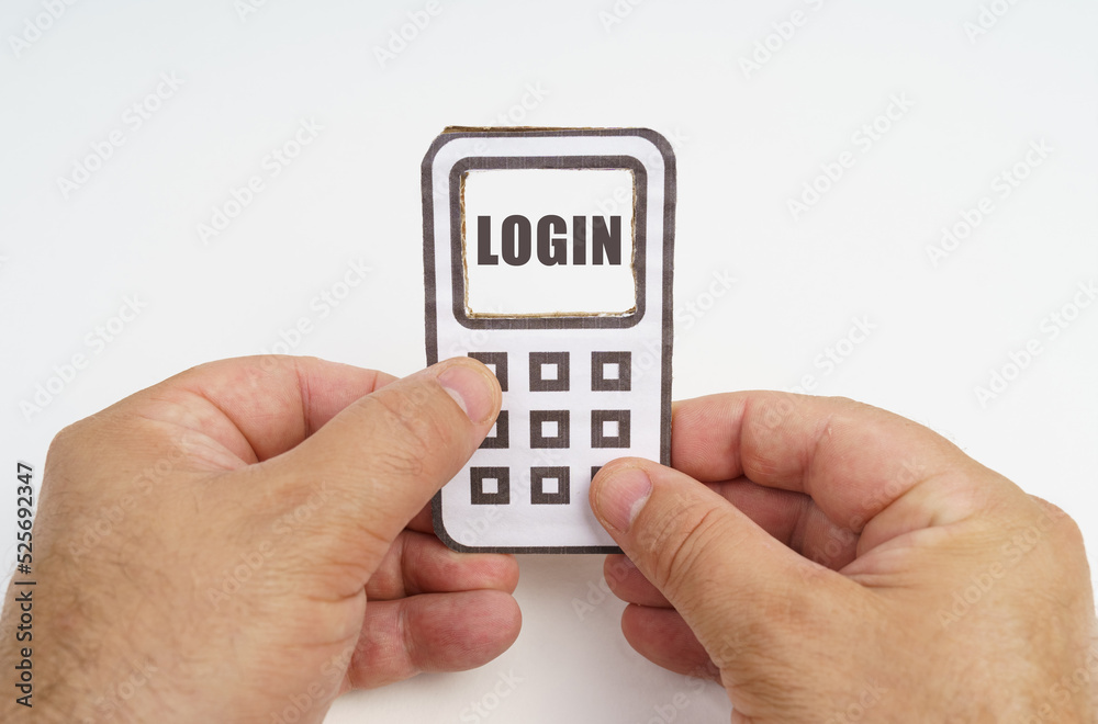 Poster in the hands of a person is a cardboard model of a telephone with an inscription on the screen - log