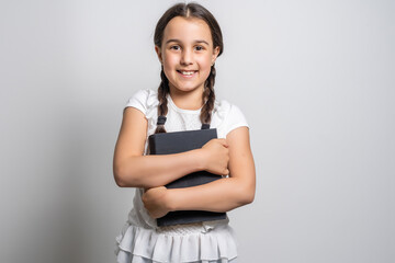 Portrait of a smiling little schoolgirl