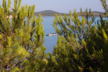 rowing team paddles on the tranquil sea. High quality photo