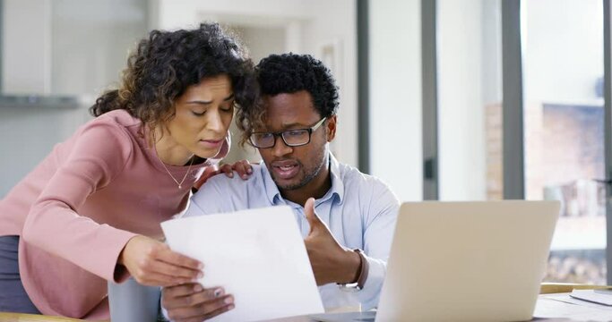 Couple stress about budget, savings and finance while working on debt bills with a laptop at home. Man and woman have anxiety with inflation increase and tax while reading banking documents at home