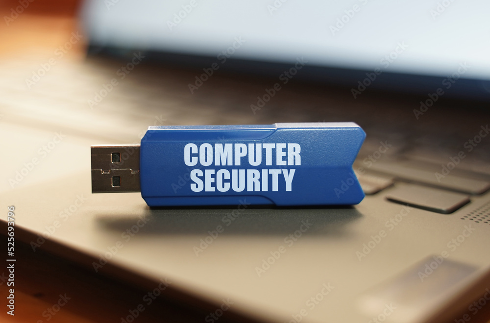 Poster On the laptop keyboard is a flash drive with the inscription - Computer security