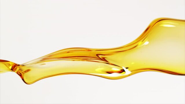 Super Slow Motion Shot of Flowing Oil on White Background at 1000fps.