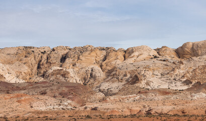 Fototapeta na wymiar Red Rock Formations and Hoodoos in the Desert at Sunrise. Spring Season. Goblin Valley State Park. Utah, United States. Nature Background.