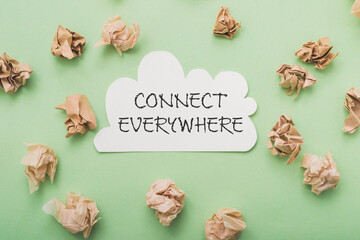 Phrase Connect Everywhere on card and crumpled papers