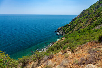 Fototapeta na wymiar Panoramic view of pebble wild beach on mount Ayu-dag near Hurzuf. Big Yalta, Crimea, Ukraine.