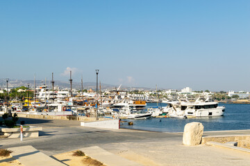 Ships in the port. Paphos, Cyprus. Harbor wharf in the middle of summer.
