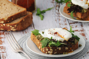 Homemade sandwiches with salmon, avocado and poached eggs	