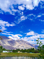 Beautiful village view with mountains,houses, greenery,sky and wonderful view.