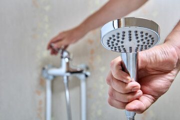 Plumber fixed leaking shower head on flexible hose.