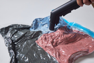 Space saver saving seal bag sucking air vacuum clothing storage compressed package.