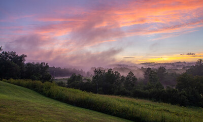 Vermont summer sunset over the field