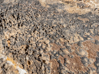 abrasions on limestone cliffs and surface changes and patterns in stones