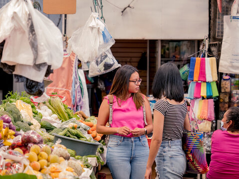 Women shopping in a local market in El Salvador. Hispanic women.