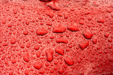 Raindrops on Red Metal