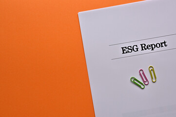 There is a dummy document of ESG Report on the desk.