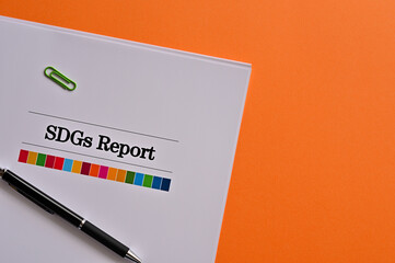 There is a dummy document of SDGs Report on the desk.