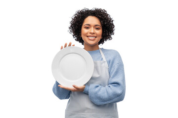 cooking, culinary and people concept - happy smiling woman in apron holding empty plate over white background