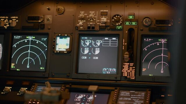 Airplane cockpit with flying command on control panel and dashboard for navigation, engine throttle and radar compass. Plane cabin with windscreen, buttons and handle. Close up.