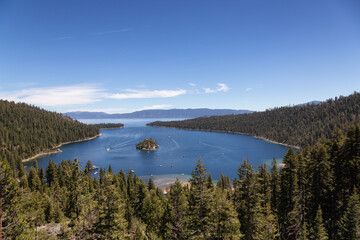 Naklejka premium View of Large Bay and Lake with Boats, Small Island, Trees and Mountains. Summer Season. Emerald Bay, Lake Tahoe. California, United States. Nature Background.
