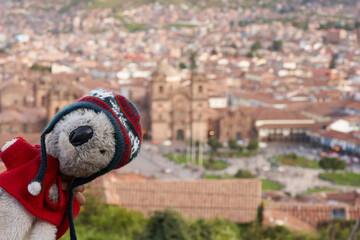 Koala plush toy having fun at the view point in Cuzco