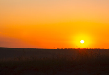 Twilight over the hill . Awesome sunset at orange sky 