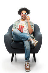cinema, leisure and entertainment concept - happy smiling young man in 3d glasses with popcorn...