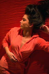 Fototapeta premium Young sexy woman in bathrobe lying on the bed with closed eyes