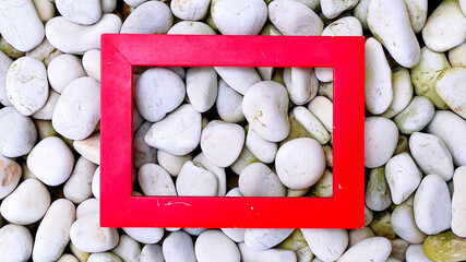 A red frame with white pebbles